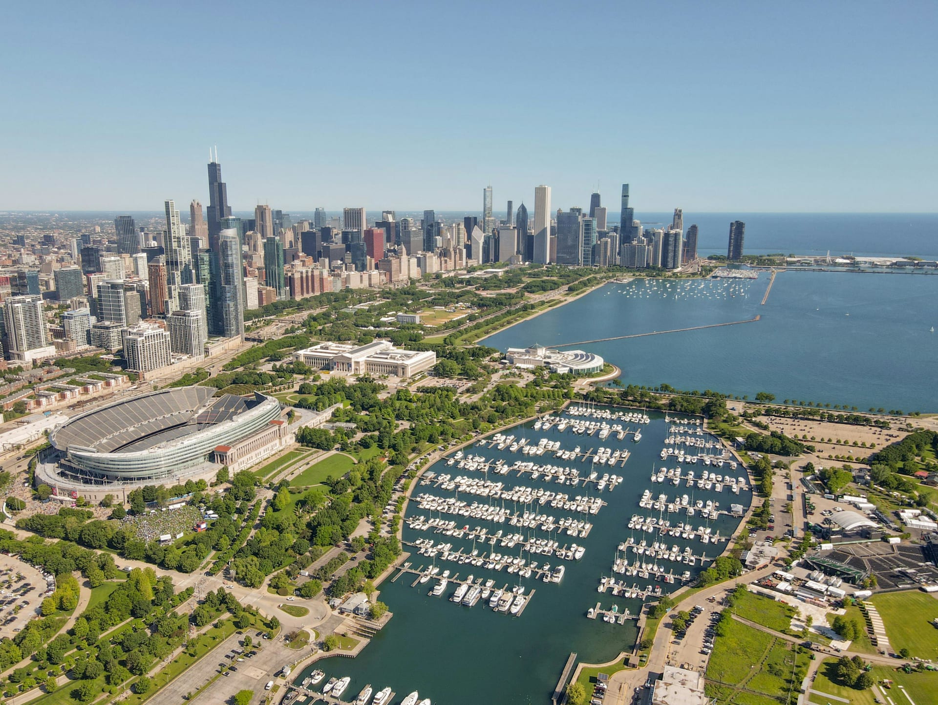Aerial view of Burnham Harbor and Soldier Field with the Chicago skyline and Lake Michigan