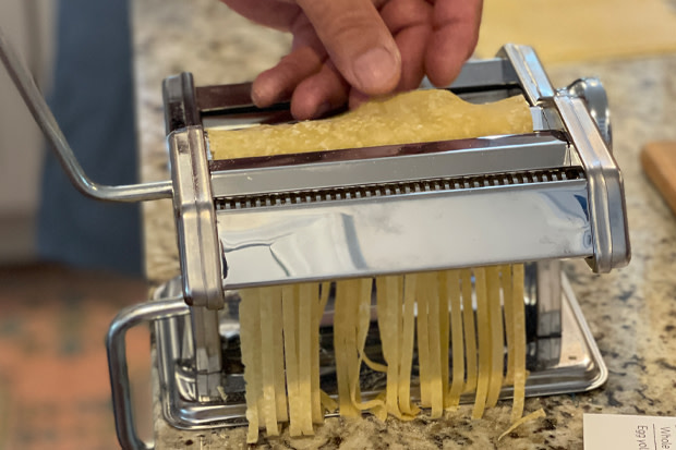 Pasta making machines clamp to the countertop edge for secure rolling of the freshly made dough.