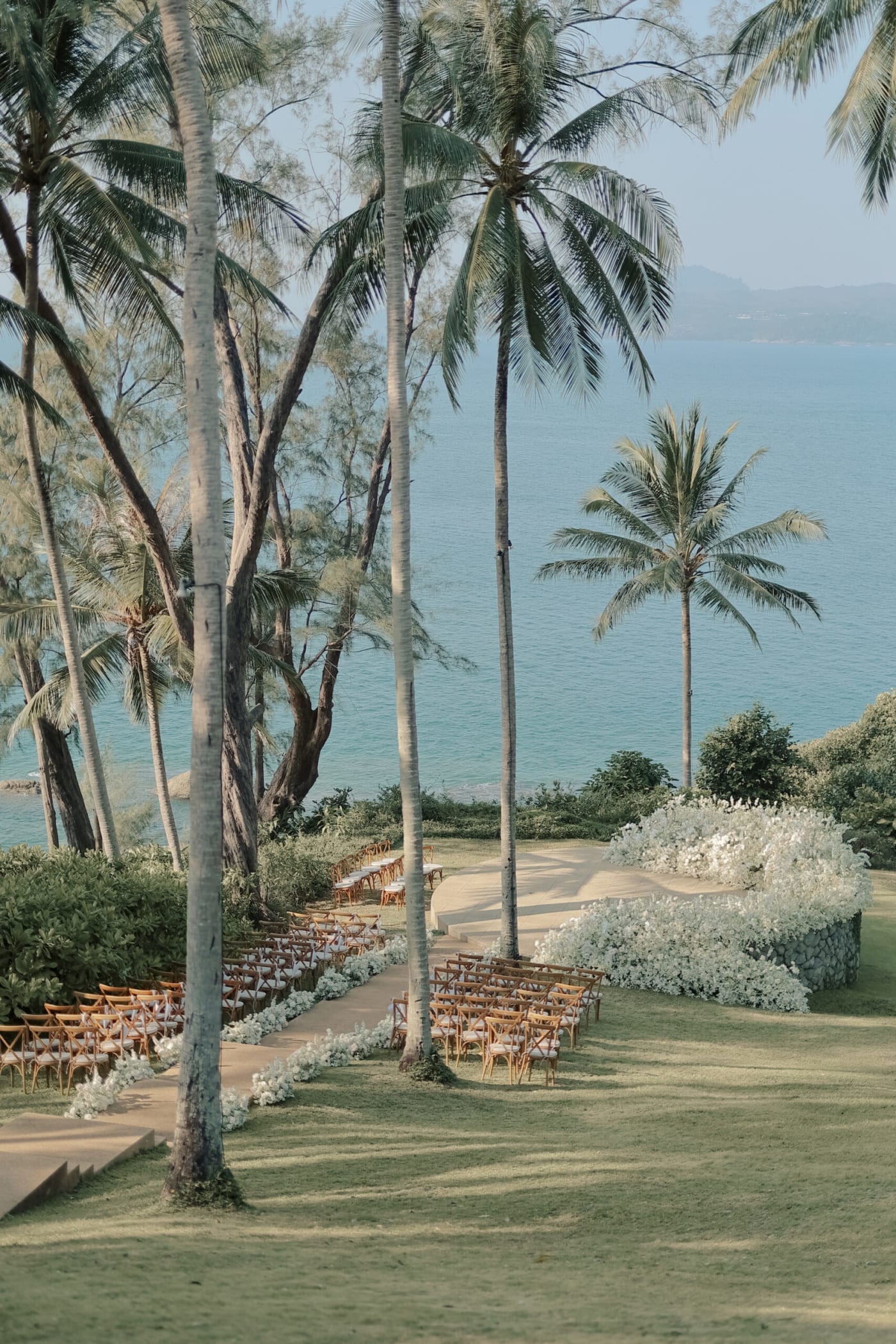 Amanpuri Phuket Thailand outdoor wedding ceremony by the Andaman Sea at sunset — Panigrahana