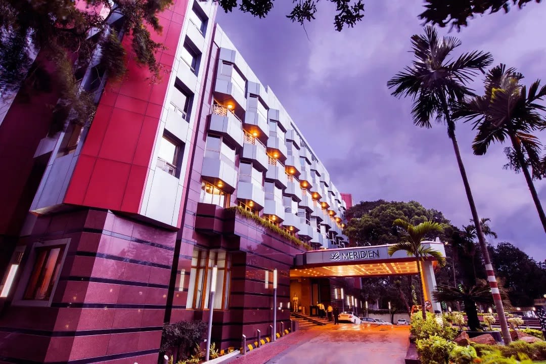 Le Méridien Bangalore outdoor wedding ceremony on scenic grounds — Panigrahana