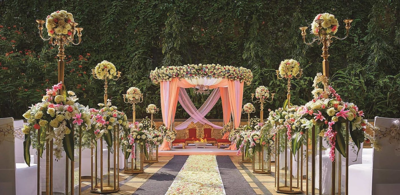 Shangri-La Hotel Bengaluru outdoor wedding ceremony lawn setup with floral decor Vasanth Nagar — Panigrahana