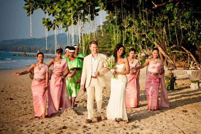 The Sarojin Khao Lak Thailand beachfront wedding ceremony with floral arch facing the Andaman Sea — Panigrahana