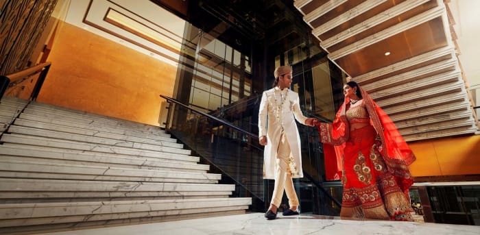 Shangri-La Bengaluru wedding stage and mandap decorated with white and gold flowers — Panigrahana