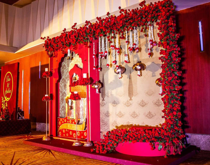 Sheraton Grand Bangalore Hotel at Brigade Gateway wedding decoration with marigold and rose arrangements — Panigrahana
