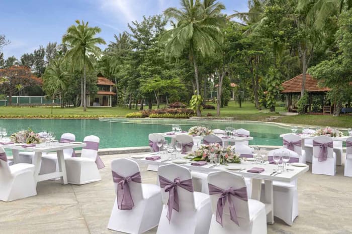 Big Banyan Vineyard Resort Bangalore outdoor sangeet setup with fairy lights and floral decor — Panigrahana