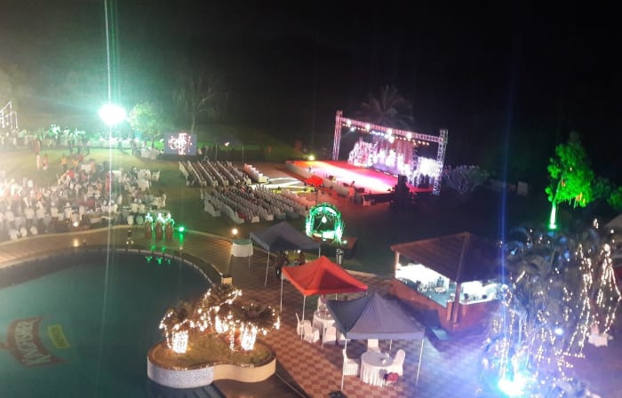 Eagleton Resort Bangalore sangeet evening decor on golf resort lawn with stage lighting — Panigrahana
