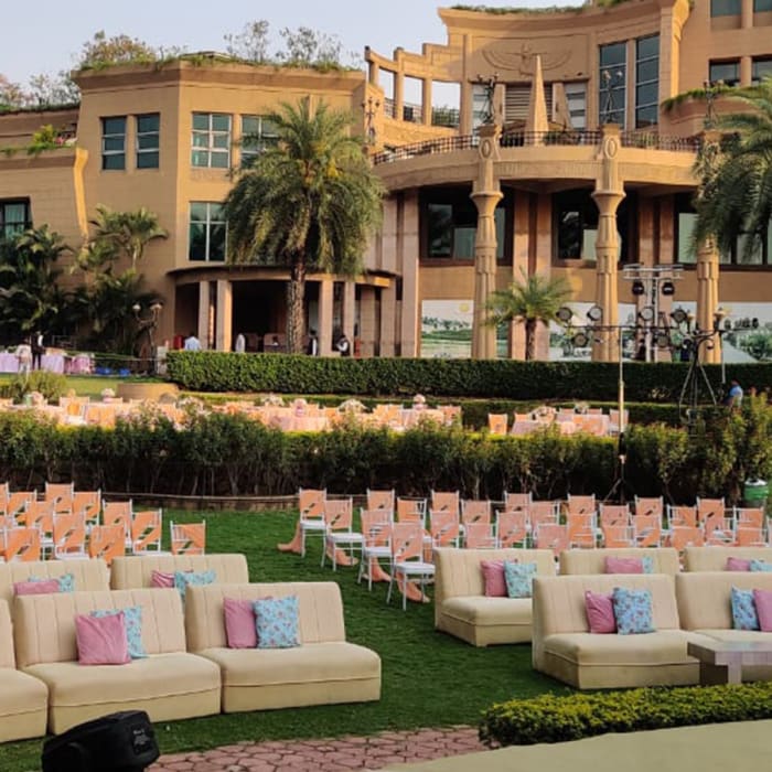 The Corinthians Resort Bangalore wedding mandap with traditional floral arrangements on central lawn — Panigrahana