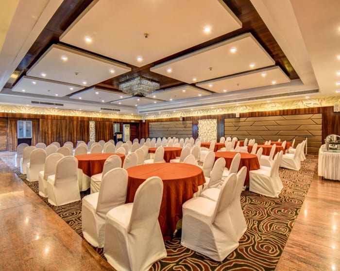The Corinthians Resort Bangalore indoor banquet hall with classic columns and elegant wedding setup — Panigrahana
