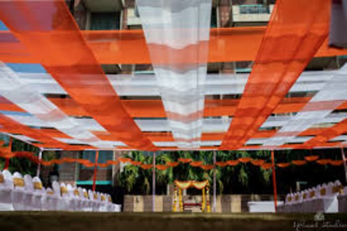 ITC Gardenia Bengaluru wedding stage decorated with fresh flowers for Hindu ceremony — Panigrahana