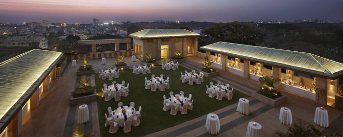 ITC Gardenia Bengaluru luxury hotel exterior and manicured grounds on Residency Road — Panigrahana