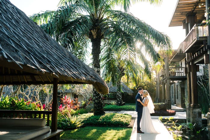 Tirtha Uluwatu Bali reception area set with elegant tablescape and candles at sunset — Panigrahana
