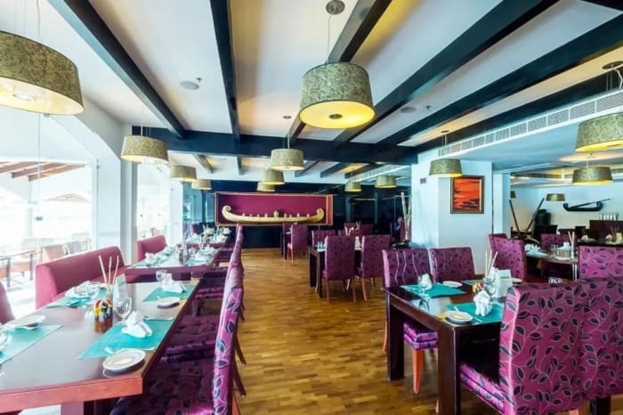 Raviz Kadavu Kerala wedding reception setup with traditional Kerala decor and lighting — Panigrahana