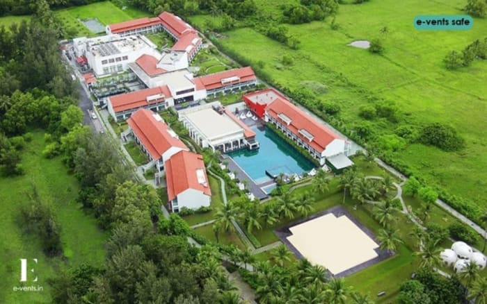 Planet Hollywood Goa outdoor wedding ceremony lawn with beach view and floral arch — Panigrahana