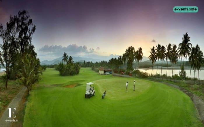 LaLiT Golf Spa Resort Goa outdoor wedding ceremony on lawn with sea view — Panigrahana