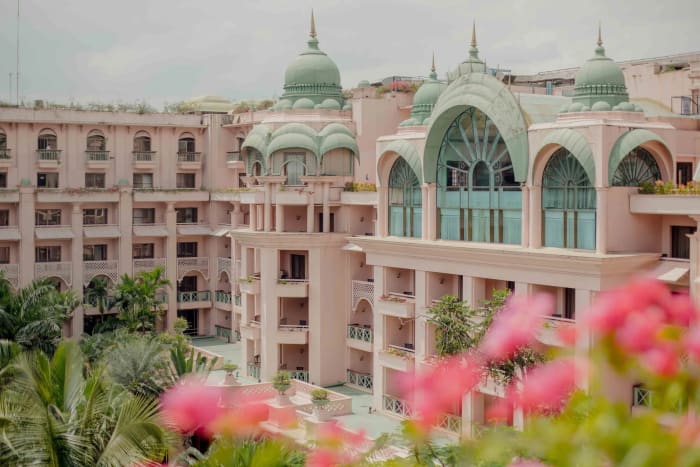 The Ritz-Carlton Bangalore grand ballroom decorated for Christian wedding ceremony with floral aisle — Panigrahana
