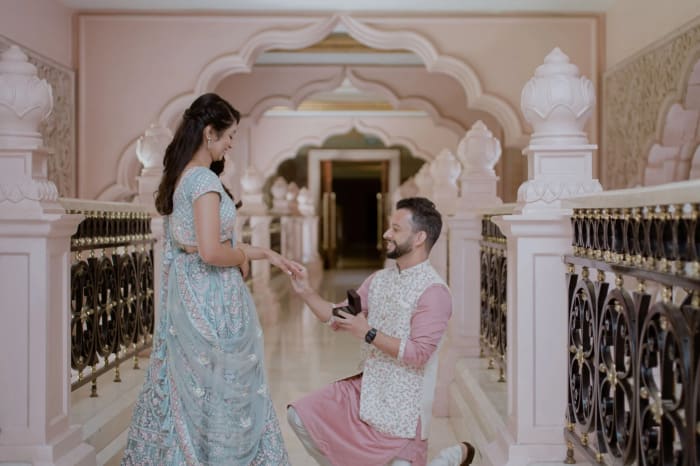 The Ritz-Carlton Bangalore pillarless ballroom set for grand Indian wedding with chandelier and floral decor — Panigrahana
