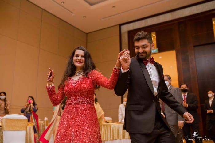 Conrad Bengaluru wedding reception hall decorated for Indian Marwari wedding with chandeliers — Panigrahana
