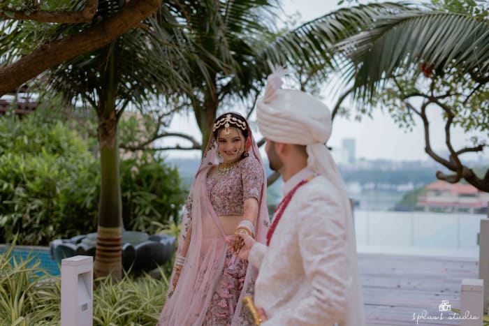 Conrad Bengaluru outdoor pool terrace decorated for wedding sangeet with fairy lights — Panigrahana