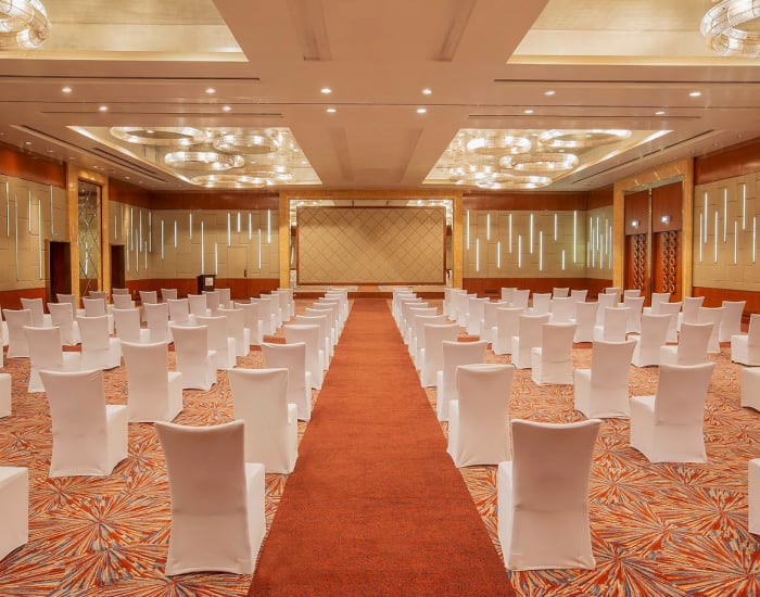 Sheraton Grand Bangalore Hotel Grand Ballroom decorated for cluster-style wedding reception — Panigrahana