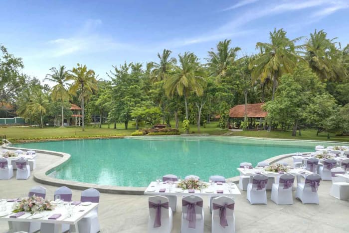 Big Banyan Vineyard Resort Bangalore wedding reception decor on scenic vineyard lawn — Panigrahana