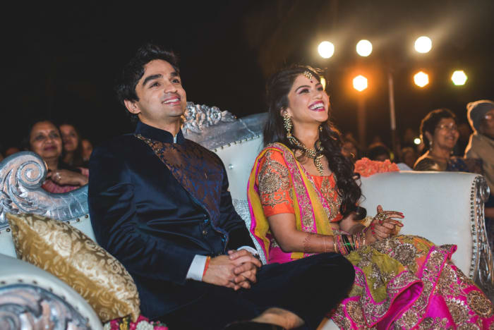 Golden Palms Bangalore grand wedding banquet hall with chandeliers and stage decor — Panigrahana