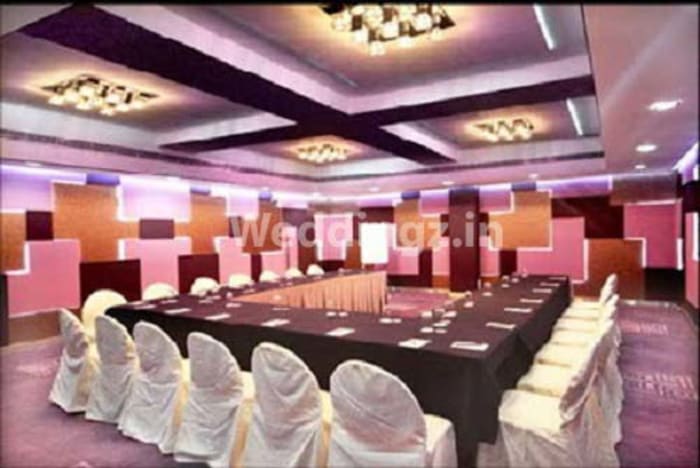 Radisson Blu Atria Bangalore Chancery hall wedding setup with round tables and floral decor — Panigrahana
