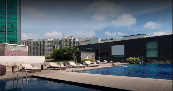 Sheraton Grand Bangalore Brigade Gateway poolside wedding event with candlelight — Panigrahana