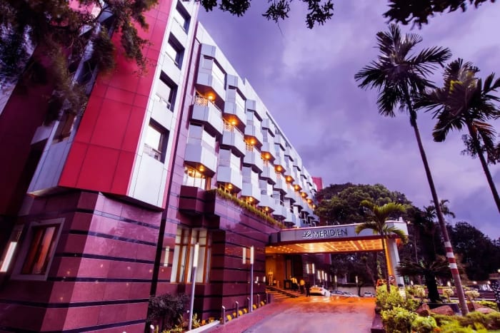 Le Méridien Bangalore outdoor wedding ceremony on scenic grounds — Panigrahana