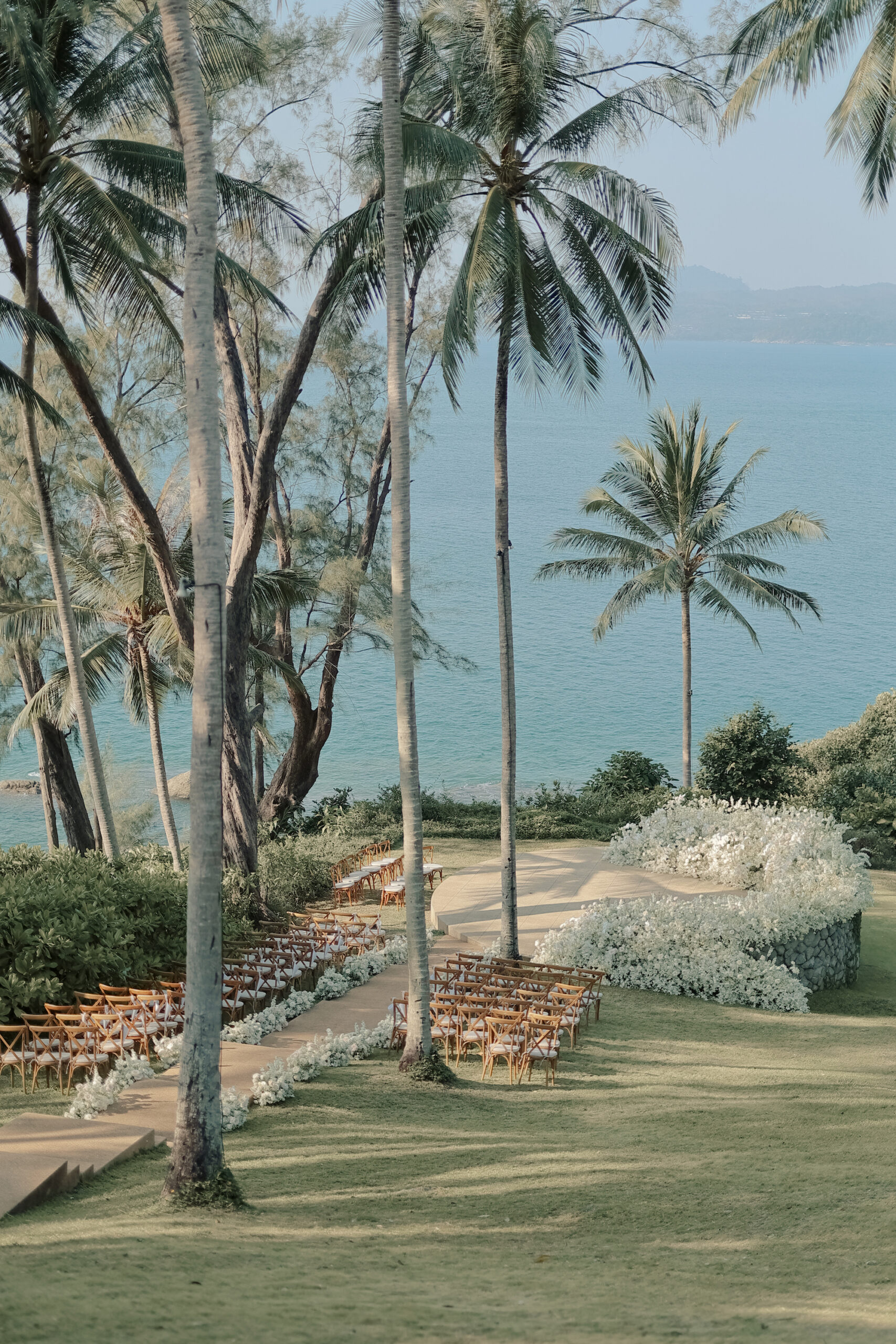Amanpuri Phuket Thailand outdoor wedding ceremony by the Andaman Sea at sunset — Panigrahana