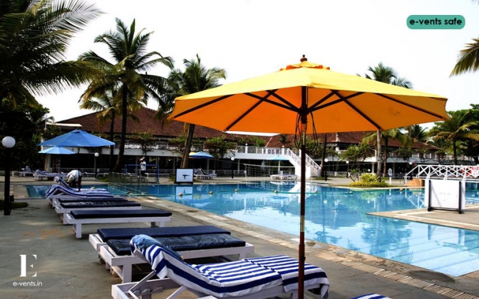 Novotel Goa Dona Sylvia wedding setup with floral arch and sea backdrop ceremony — Panigrahana