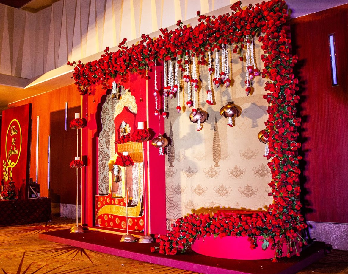 Sheraton Grand Bangalore Hotel at Brigade Gateway wedding decoration with marigold and rose arrangements — Panigrahana