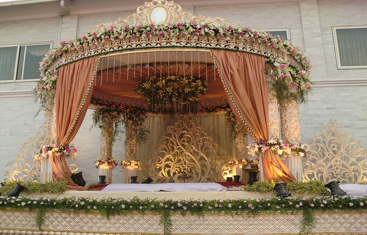 Eagleton Golf Resort Bangalore wedding reception setup on lush resort lawn surrounded by greenery — Panigrahana
