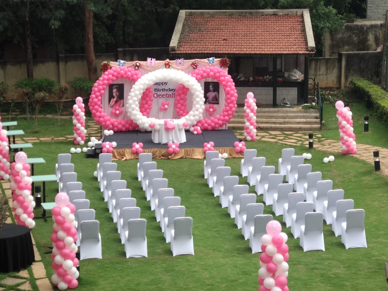 Angsana Oasis Spa Resort Bangalore sangeet stage decor with fairy lights and drapes — Panigrahana