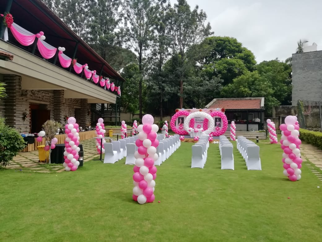 Angsana Oasis Bangalore wedding couple ceremony on lush resort garden with pool view — Panigrahana