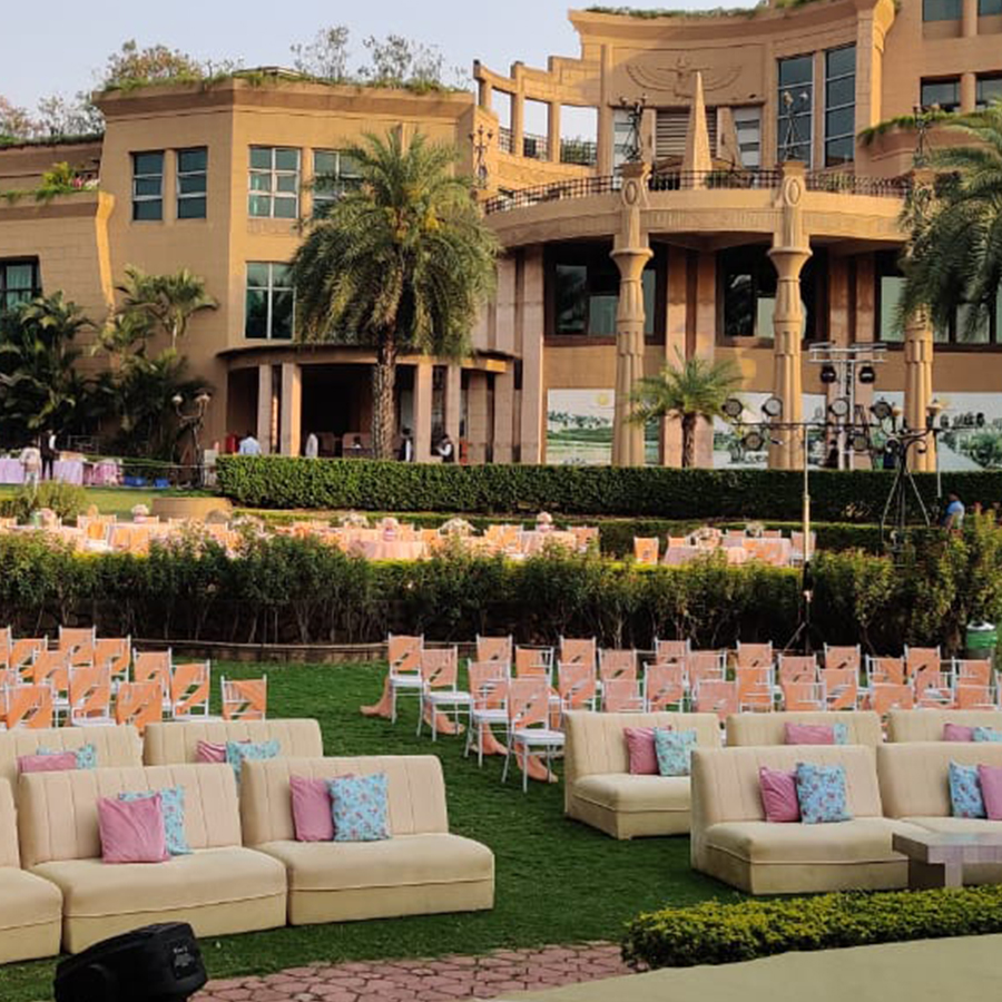 The Corinthians Resort Bangalore wedding mandap with traditional floral arrangements on central lawn — Panigrahana