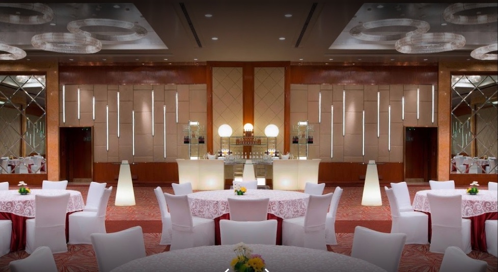 Sheraton Grand Bangalore Brigade Gateway sangeet stage with lights and drapes — Panigrahana