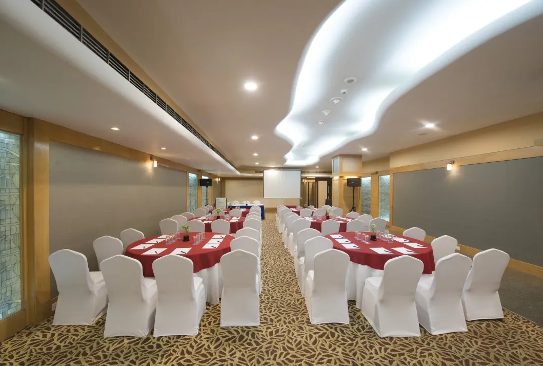 Le Méridien Bangalore sangeet stage with lights and drapes — Panigrahana