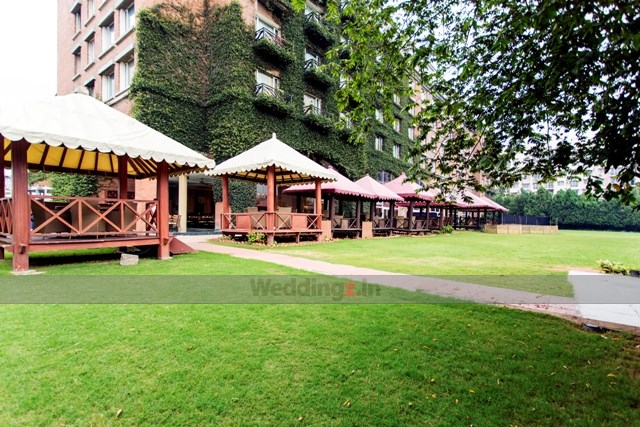 Royal Orchid Bangalore outdoor wedding ceremony on scenic grounds — Panigrahana