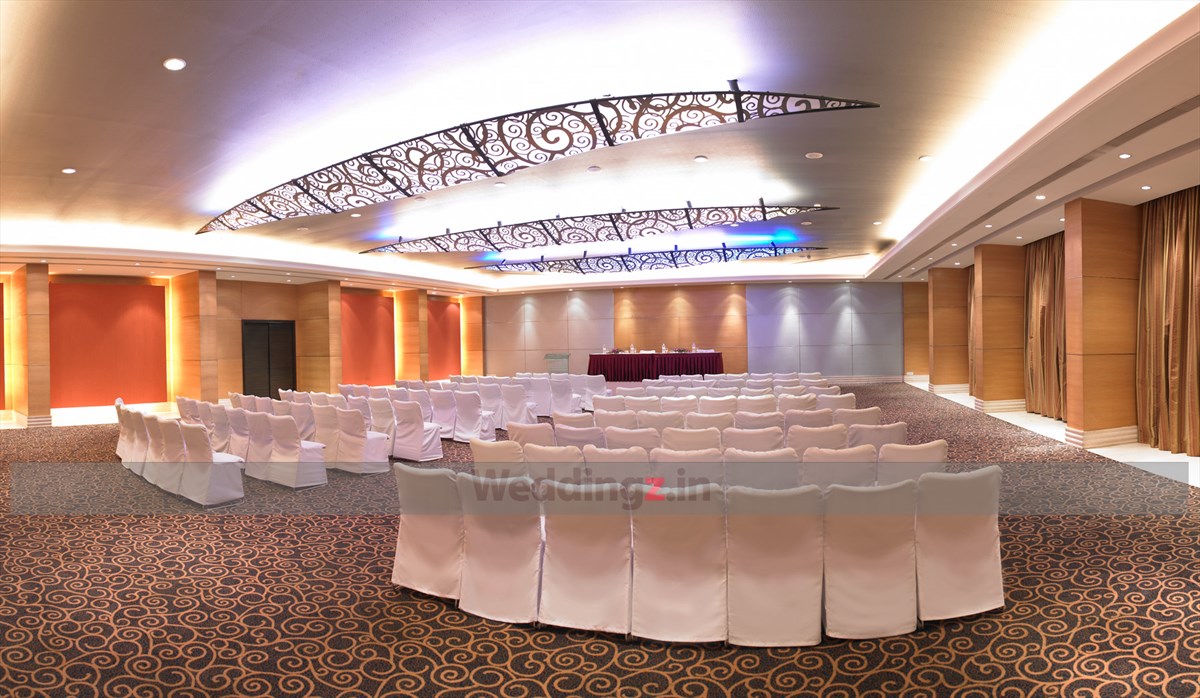 Royal Orchid Bangalore garden wedding ceremony with marigold and rose arch — Panigrahana