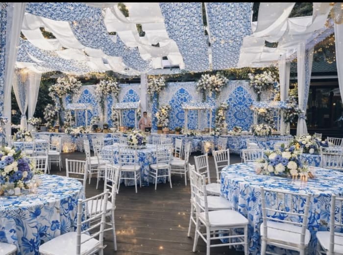 Blue and white chinoiserie wedding reception with patterned linens