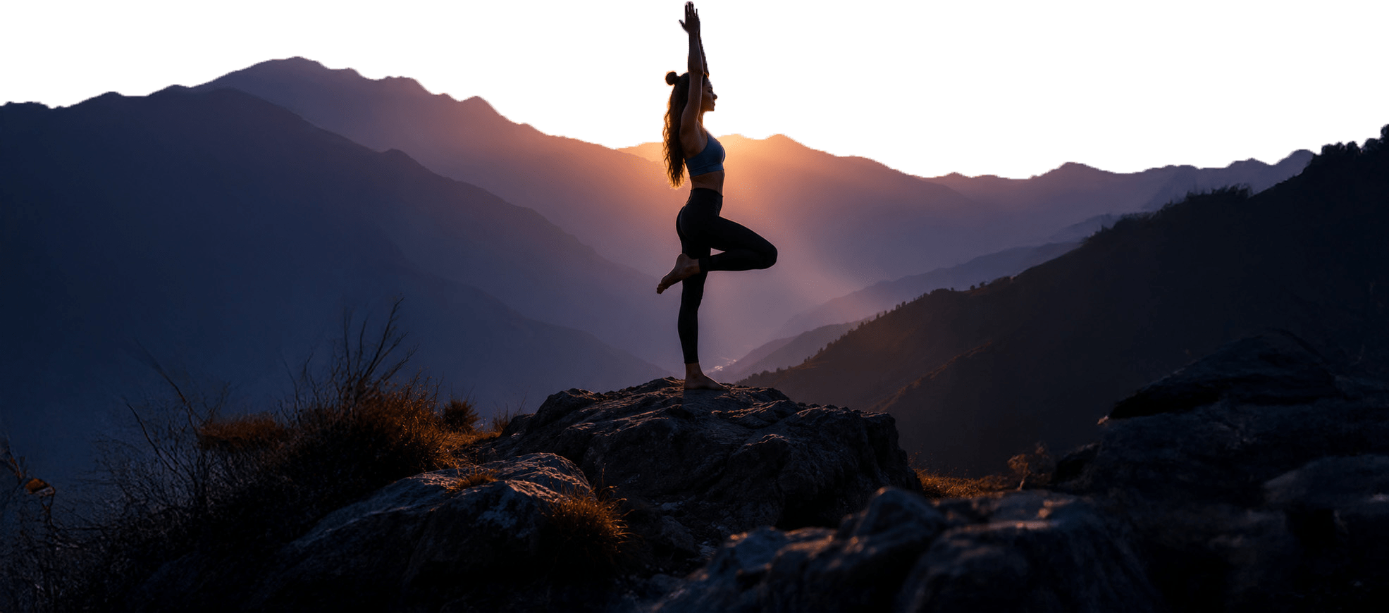 Person practicing yoga in the mountains