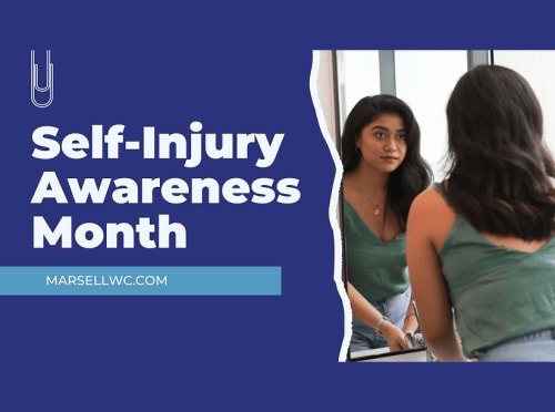 A teenager is looking at her reflection in the mirror.