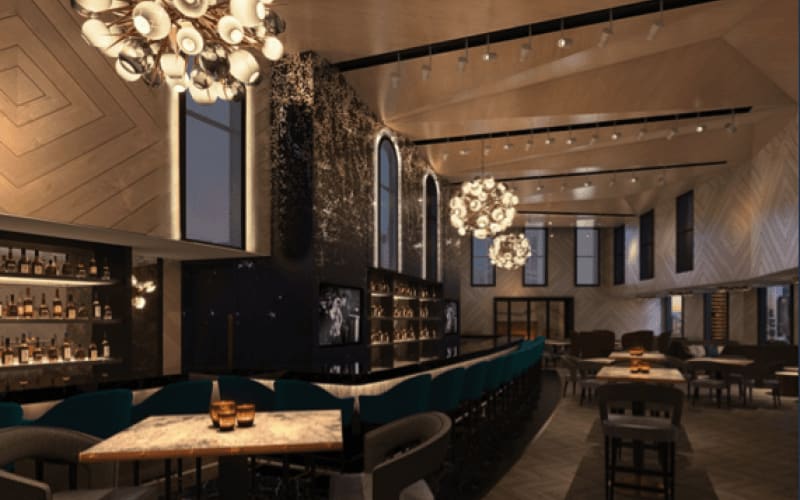 View of the inside bar at the hotel with beautiful, big pendant chandeliers.