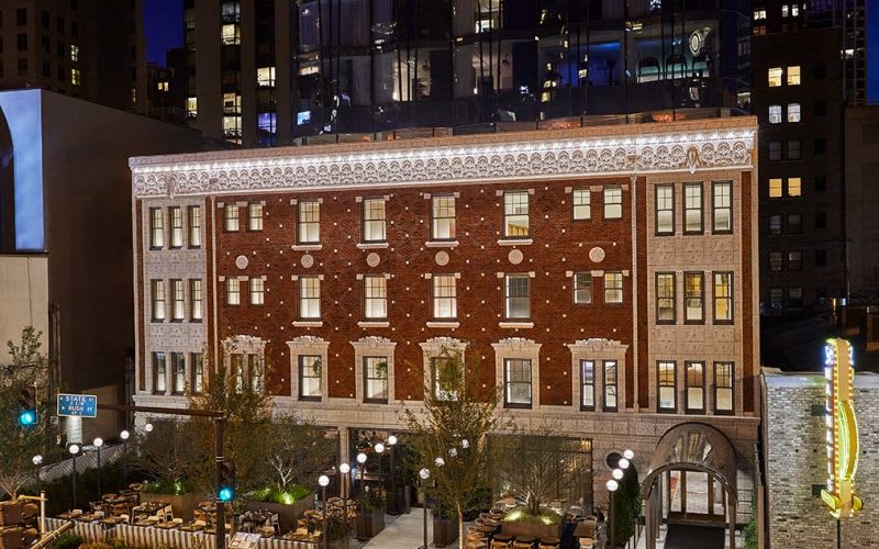 The outside of the Viceroy Hotel illuminated during nighttime.