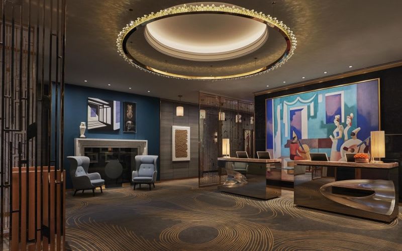 Space in the Viceroy Hotel with a large, rounded ceiling light.