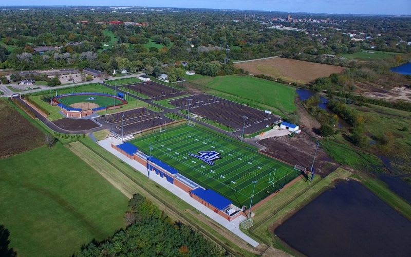 An aerial view of the Spartan sports complex, showcasing a football and baseball field.