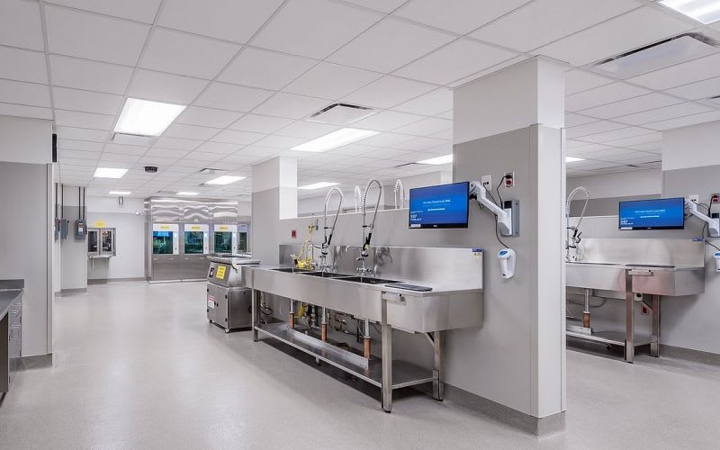 Laboratory with sinks, screens and medical equipment.