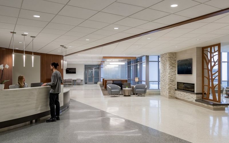 Front desk at the lobby with a patient checking in with medical staff.