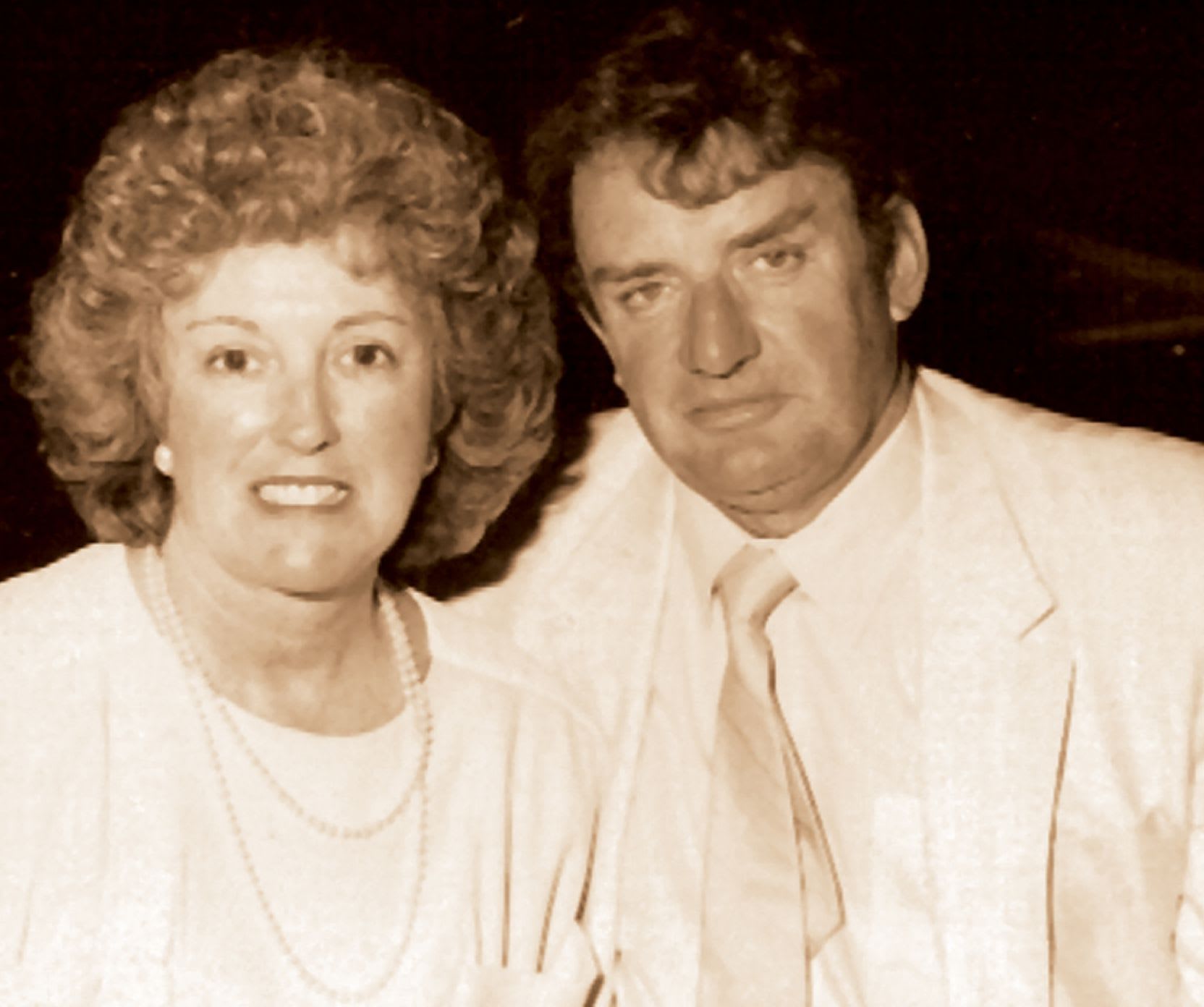 Two leading members of the Connelly family posing next to each other.