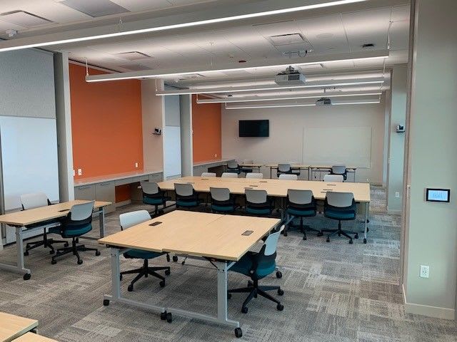 Conference rooms inside the center with long, linear lighting.